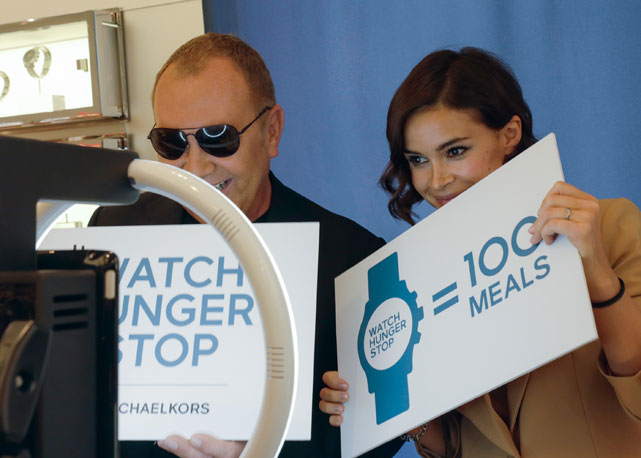 Michael Kors com Miroslava Duma no Rockefeller Center - Foto: Getty Images