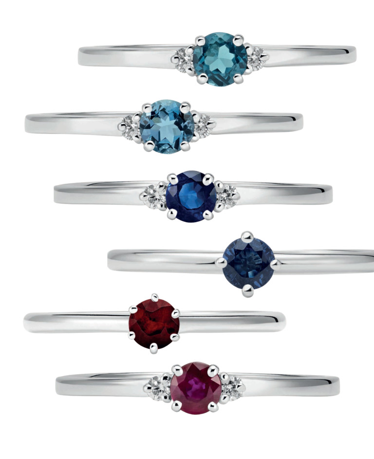 De cima para baixo, anel de topázio e diamantes inspirado no céu do Sri Lanka; anel de água-marinha e diamantes inspirado no céu do Brasil; anel de safira e diamantes inspirado no céu da Tailândia; anel de safira; anel de rubi e anel de rubi e diamantes inspirado no céu da Birmânia - Foto: Divulgação
